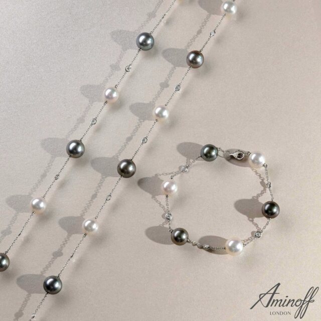 A refined expression of balance and contrast, this 18ct white gold necklace and bracelet set pairs 9mm AAA Akoya and Tahitian pearls, each carefully selected for exceptional lustre, surface quality, and harmonious tone.
 
Diamond-set accents introduce subtle brilliance, enhancing movement and light throughout the design. Elegant yet highly wearable, this is a modern pearl suite suited to both everyday luxury and occasion dressing.

Available online at www.aminofflondon.com by searching MAN9.

#FineJewellery #PearlJewellery #AkoyaPearls #TahitianPearls #LuxuryJewellery #JewelleryDesign #DiamondJewellery #HighJewellery #JewelleryBuyers #RetailJewellery #GoldJewellery #ModernPearls #JewelleryCollection #LuxuryPearls