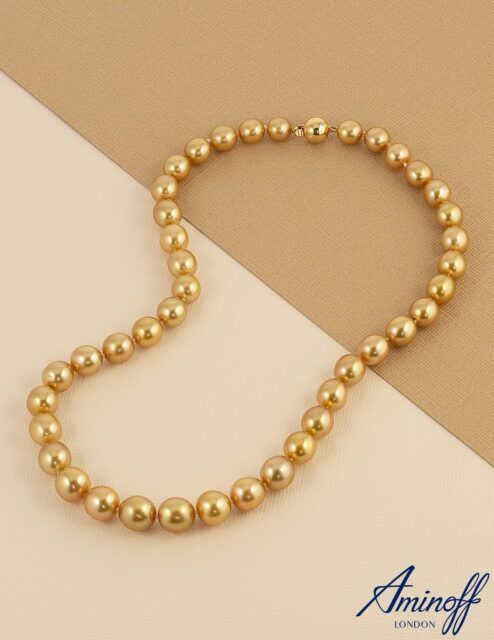 Sourced from the Indonesian archipelago, these natural colour golden South Sea pearls are cultivated within the gold-lipped oyster, a process that can take several years to achieve their rich, intense tones. Each pearl is unique, with its certified golden hue reflecting both rarity and origin.
 
Graduated in size and finished with a scattered diamond 18ct yellow gold clasp, the necklace captures the harmony between nature and craftsmanship, offering a statement of enduring sophistication and rarity.
 
#GoldenSouthSeaPearls #IndonesianPearls #PearlNecklace #LuxuryJewellery #FineJewellery #GoldJewellery #RarePearls #StatementJewellery #DiamondDetails #HighJewellery #JewelleryCollector #ElegantDesign #TimelessLuxury #PearlLovers #CertifiedJewellery