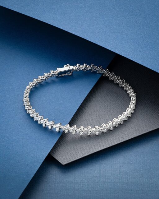 A distinctive interpretation of the classic diamond line bracelet.
 
Part of The Diamond Collection by Aminoff London, this trefoil bracelet features repeating clusters of diamonds arranged to create a soft, sculptural rhythm across the wrist. The design offers greater character and movement than a traditional single-row bracelet while remaining elegant, balanced and highly wearable.
 
Crafted in 9.55g of 18ct white gold and set with 4.00cts of diamonds, it reflects our commitment to producing original diamond jewellery with an exceptional balance of design, quality and value.
 
Available to view and order through our Hatton Garden office.
 
#Diamonds #FineDiamonds #DiamondBracelet #LuxuryJewellery #AminoffLondon