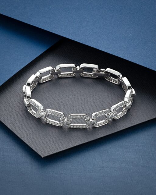 Contemporary form, substantial craftsmanship and refined diamond detail.
 
This bold bracelet from The Diamond Collection combines polished rectangular links with carefully set diamonds, creating a striking contrast between clean 18ct white gold surfaces and continuous brilliance. 

Its articulated construction gives the piece fluidity on the wrist, while the generous gold weight creates a distinctly substantial and luxurious finish.
 
Crafted in 20.2g of 18ct white gold and set with 3.38cts of diamonds, this is a modern statement bracelet designed with longevity, versatility and expert craftsmanship in mind.
 
Available to view and order through our Hatton Garden office.
 
#Diamonds #FineDiamonds #DiamondJewellery #HighJewellery #AminoffLondon