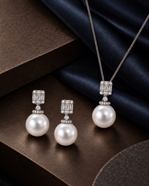 Bold. Regal. Perfectly balanced.

Our 18ct white gold illusion-set diamond earrings and pendant are finished with luminous white South Sea pearls, combining architectural diamond detailing with exceptional movement and presence.

The interplay between the crisp geometry of the illusion-set diamonds and the soft lustre of the South Sea pearls requires careful balancing in both design and manufacture. Each piece is expertly crafted to ensure elegance, comfort, and the refined articulation needed for beautiful movement when worn.

#FineJewellery #PearlJewellery #SouthSeaPearls #DiamondJewellery #AminoffLondon